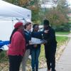 Victoria Krueger, a student ambassador stationed in an information tent by "The Rock," points a family in the right direction.