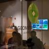 Gower (at podium) discusses the Fibonacci spiral (on monitor) as part of her talk on sacred geometry.