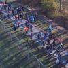 An aerial view shows runners bundled up and starting out. 