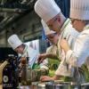 School of Business & Hospitality majors from Penn College take part in a Student Cooking Challenge at the 2018 Pennsylvania Farm Show. All six of the college’s academic schools will again be represented at the Jan. 5-12 event, the nation’s largest indoor agricultural expo. (Photo by Davey Rudy)