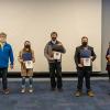 Chip D. Baumgardner (left), associate professor of business administration/management, joins four of the 28 Pennsylvania College of Technology students who earned Innovation Engineering Blue Belts and Black Belts for their work in 2021. From left are Ashley N. Rich, of Mill Hall (Blue Belt); Ryan J. Hill, of Williamsport (Black Belt); Tim W. Wegman, of Palmyra (Blue Belt); and Melissa M. Stocum, of Williamsport (Blue Belt).