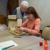 Amanda McCavour (seated) provides artistic assistance to workshop participant Sally Ickes, of Danville. 