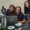 Three SMART (and pleasant) Girls pause during preparation of their Monarch Butterfly display ... 