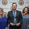 Penn College alumnus John R. Yogodzinski (’07, graphic communications management) is joined by Debra M. Miller, vice president for institutional advancement (left), and Kimberly R. Cassel, director of alumni relations, at the Williamsport/Lycoming Chamber of Commerce Education Celebration.