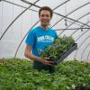 With a warm smile, colorful T-shirt and blooms on hand, Aaron A. Sledge Jr., a freshman in landscape/horticulture technology: plant production emphasis from Pittsburgh, is ready to share his love of plants with visitors. 