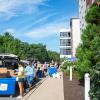 Gorgeous skies greeted families for most of the day (except for a short downpour in the afternoon). Here, movers get busy outside Dauphin Hall. 