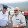 Enjoying the Aviation Center surroundings are John Hertel, (left) ’48, agricultural equipment and repair, and ‘49, electric and acetylene welding, and Ralph Mills, ’58, plumbing.