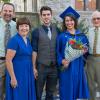 Katelyn E. Watson, a radiography grad from Turbotville, marks the day with a true Penn College legacy family, including her father, Chip (far left), a 1980 Williamsport Area Community College graduate who majored in heavy construction equipment.  