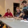 Repko interacts with students during a “Bridging the Gaps” workshop, where participants built bridges representing the past, present and future as they relate to the artist’s work.