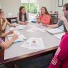 Some of the students in the Community and Organizational Change course discuss logistics in support of the Community Challenge. From left are Holly N. Engel, Montoursville; Sabrina A. Schubert, Clarks Summit; Brooke L. Gray, Muncy; Mandy M. Myers, Duke Center; Travis R. Neyhart, Jersey Shore; and Tierney N. Lookingbill, York. All of the students are enrolled in the applied human services major. 