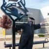 The brand-new holder of a degree in information assurance and cyber security, Thomas M. Herr, of Hummelstown, exults near the welded Wildcat north of College Avenue Labs – just one of the picture-perfect backdrops shared with commencement families.