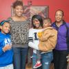 Kyani L. Lawrence (center), a first-year pre-nursing major from New Rochelle, New York, who also served as a Connections Link this summer, poses with her family in Wrapture.