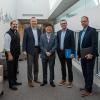 Prior to setting off on their wide-ranging campus tour, the visitors pause for a group photo with Penn College’s president on the third floor of the Davie Jane Gilmour Center. From left: Brennan, Reed, Ryoo, Gasbarre and Lashinsky. 