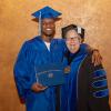 Graduate Isaiah S. Robinson poses with President Davie Jane Gilmour after the May 14 afternoon commencement ceremony ...