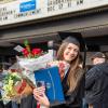 Madison T. McClelland earned a bachelor's in nursing ... and, judging from her keepsake-filled hands, a minor in juggling.