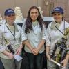 Penn College students took first- and third-place awards in the Student Tiered Wedding Cake category at the 2018 Atlantic Bakery Expo. Three Penn College students competed. From left are Taylor M. Bickhart, of Middleburg, who received third place; Sarah A. Waclo, of York; and Jacqueline R. Dull, of Mohnton, who took first place. Their respective cakes are behind them.