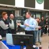 Brad M. Martin (center) and alumnus Peter J. Shkuda (right) speak with ACE Mentor participants about the 100-percent placement rate among Penn College's construction management graduates. (Photo by Susan Martin)