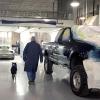 Alfred M. Thomas II and Jesse, side-by-side in Penn College’s collision repair lab.