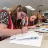 Penn College emergency management technology students, including Autumn M. Devine (foreground), of Mars, engage in a disaster response exercise at the Emergency Operations Center in Williamsport. 