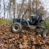 Tyler J. Bandle, of Slatington, majoring in automated manufacturing technology at Pennsylvania College of Technology, drives the school’s Baja SAE car through a test track cleared by heavy construction equipment technology students. The rugged track at the college’s operations training site replicates conditions the team will face during the endurance race at Baja SAE competitions in 2022. 