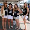 Uniformly expressing an oft-heard Saturday sentiment is an entourage that includes Ashley R. Hilfiger (second from right), a 2010 technology management alum. 