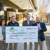 Acknowledging a $5,000 donation outside the Community Arts Center are (from left) Ana Gonzalez-White, college relations officer, CAC; Matt Gottschall, community office manager, Woodlands Bank; Jim Dougherty, the arts center's executive director; and Jon Conklin, Woodlands' president and CEO.