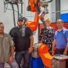 CLOOS Robotic Welding has entrusted a QRC 320 upright robot with V9 controller to Pennsylvania College of Technology. With the equipment in the college’s welding lab are, from left, Ryan P. Good, assistant professor of welding; Aaron E. Biddle, instructor of welding; Elizabeth A. Biddle, director of corporate relations;  and James N. Colton, assistant professor of welding.