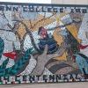 A mosaic created for Penn College’s Centennial by eight students and an instructor adorns a wall at the Physician Assistant Center on the main campus.