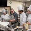 Chef Brian Doyle, ’94, troubleshoots a formula with students (from left) Sydney L. Mahoney, of Roaring Spring; Christopher J. Macdonald, of Emmaus; and Emily E. Kohen, of Mill Hall.
