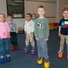 Youngsters in Penn College’s Children’s Learning Center practice their coordination skills on “stilts,” which are among the materials purchased through a grant to enhance physical activity and nutrition lessons.