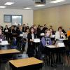 Fronted by table tents identifying their adopted states of origin, delegates prepare to tackle a packet of resolutions.