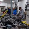 Electronics students at Pennsylvania College of Technology finish installing a conveyer unit in a new lab at the college’s Center for Business & Workforce Development. The addition of two automation engineering technology baccalaureate degrees prompted the creation of the electronics lab. Besides the conveyer system, the space features 16 programmable logic controller stations and four Kuka industrial robots. About 60 students per semester are using the lab.