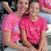 Enjoying family time at the ballpark are Tammy M. Rich, director of alumni relations, and daughter Ashley.