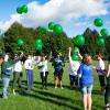 Friends and family gather in memory of a loved one lost to suicide.