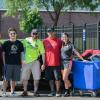 Admissions representative Salvatore Vitko (in yellow shirt) and Resident Assistant Mary K. Slipe (far right) help the family of James F. Bowman IV. Bowman, of Fleetwood, is enrolled in automotive technology: Honda PACT emphasis.