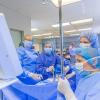 Under the supervision of Scott A. Geist (background), director of surgical technology, students explore the hands-on world of the operating room.