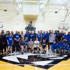 Alumni hoopsters join current Wildcat athletes and coaches in a midcourt mingle.