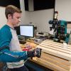 A "wired glove” created by Penn College student David M. Slotnicki, of Oil City, allows him to manipulate the arm of a robot.