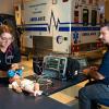 Under the supervision of Brady L. Breon, assistant professor of paramedic, Penn College student Alyssa M. Ogden, of Lawrenceville, performs an endotracheal intubation on a pediatric manikin in the college’s well-equipped paramedic laboratory. The college will host an information session on its emergency medical services programs on April 24.