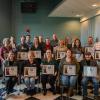 Employees gather with their Blue Belts in Innovation Engineering, issued by the Eureka! Ranch’s Innovation Engineering Institute.