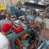 Brennan B. Wodrig, PIRC program manager, (third from left) works with workshop participants on generating coextruded sheets during the recent Extrusion Seminar & Hands-On Workshop at Penn College.