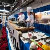 Students in Penn College’s hospitality majors join their instructor, Chef Michael J. Ditchfield, on the Culinary Connection stage at the Pennsylvania Farm Show last January.