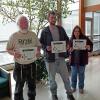 From left, Penn College forest technology students Mark J. Weist, of Montgomery; Derek S. Labs, of Jersey Shore; and Sharon L. Morris, of Liberty, hold their honor certificates in the Schneebeli Earth Center.