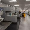 Fulfilling an integral overnight task – tending to specialty laboratories so they're ready for learning each morning – third-shift custodian Gina A. Matrey cleans a sink in the dental hygiene lab. 