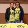 Photographed during a recent THON "Gold Out" benefit in Bardo Gym, Kelsey J. Maneval (left) and Madeline A. Lusk sell (and wear) the charity's T-shirts, while putting a friendly face to the serious battle against pediatric cancer.