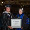 Ryan P. Good, assistant professor of welding, was presented with the highest honor accorded to Penn College faculty – the Veronica M. Muzic Master Teacher Award. He is shown here with Penn College President Davie Jane Gilmour. 