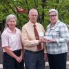 James Yemzow, of the Harrisburg Area Volkswagen Owners Club, accompanied by another HAVOC member, Patricia Shaffer (left) presents a check for the club’s scholarship to Penn College President Davie Jane Gilmour.