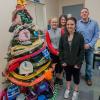 Members of Penn College’s Student Nurses’ Association gather with a tree full of hats, gloves and scarfs to be donated to the New Love Center in Jersey Shore. From left are Emily L. Gardner, a nursing student from McClure; SNA President Monica A. Flexer, a nursing student from Williamsport; Treasurer Josalynn M. Heichel, a nursing student from Millerstown; and Secretary Chad R. Guiswite, a nursing student from Loganton.