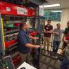 Program manager Christopher J. Gagliano (left) conducts a laboratory session in the Plastics Innovation & Resource Center's Thermoforming Center of Excellence.