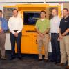 Accompanying the donation of a wireless kiosk for Penn College's construction management major are, from left, David W. Milford, regional manager for Hensel Phelps; Marc E. Bridgens, dean of the college's School of Construction & Design Technologies; John A. Cowan, operations manager for the company; students Nicholas S. Tomaine and Lane M. Ackerman; Brian J. Fish, project superintendent and a 2002 alumnus; and Wayne R. Sheppard, assistant professor of construction management.